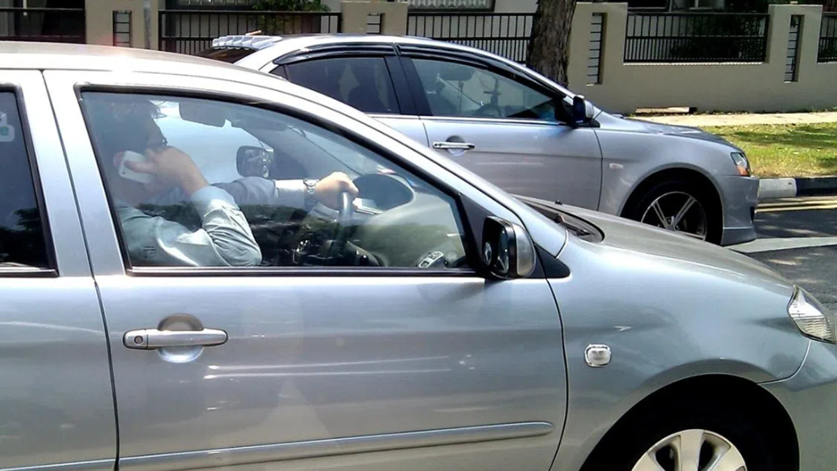 Singapore tightens traffic laws with jail, fines for simply holding phone while driving