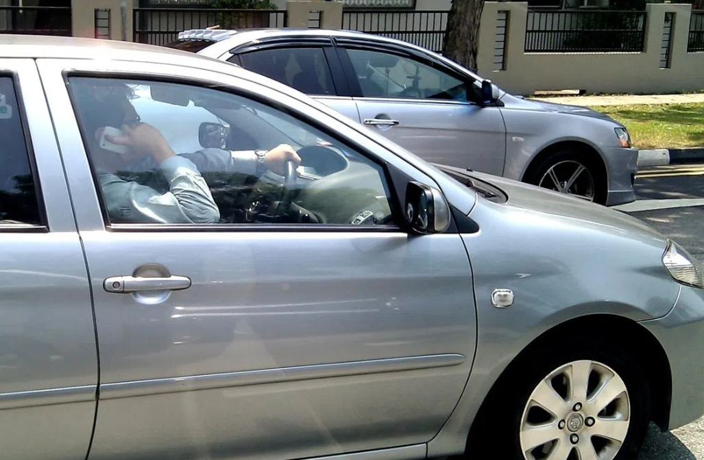 Singapore tightens traffic laws with jail, fines for simply holding phone while driving